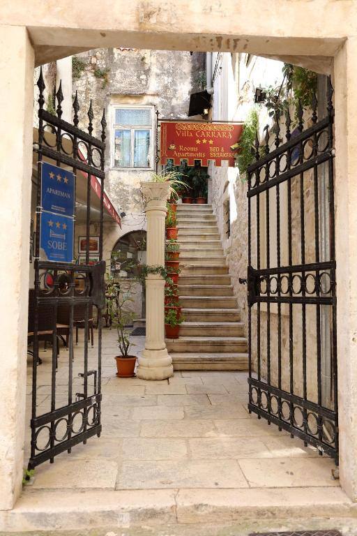 Villa Carrara - stone entrance gate in the old town of Trogir, Croatia