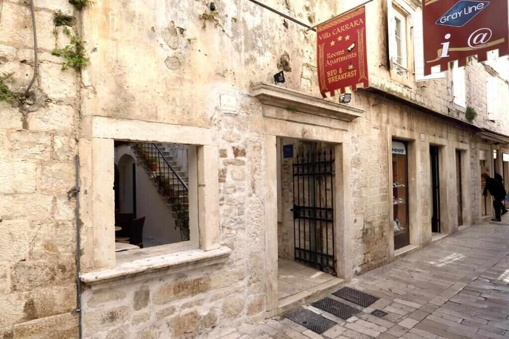 Stone facade of Villa Carrara on Gradska street in Trogir